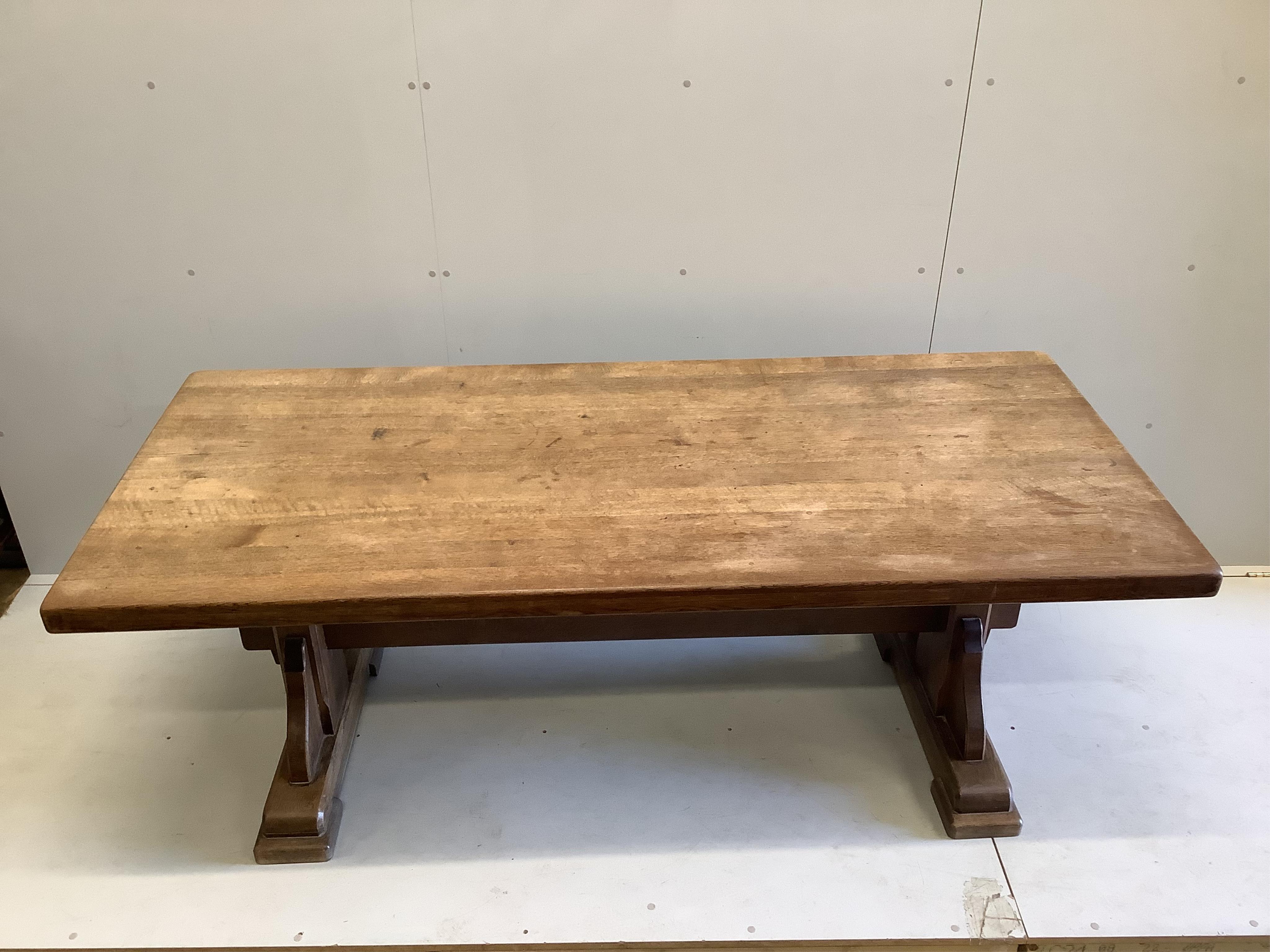 An 18th century style rectangular oak refectory dining table, width 200cm, depth 89cm, height 75cm. Condition - fair